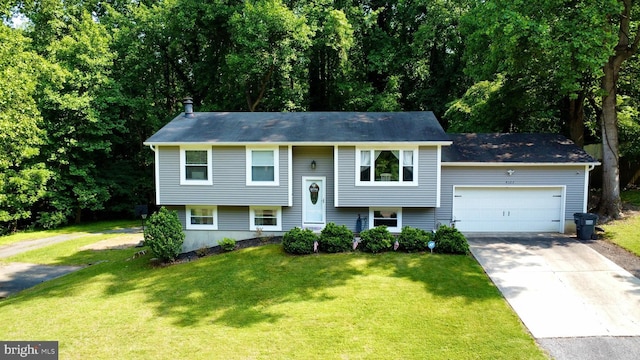 4123 Cassell Blvd, Prince Frederick, MD 20678 - split foyer home with driveway, a garage, and a front lawn