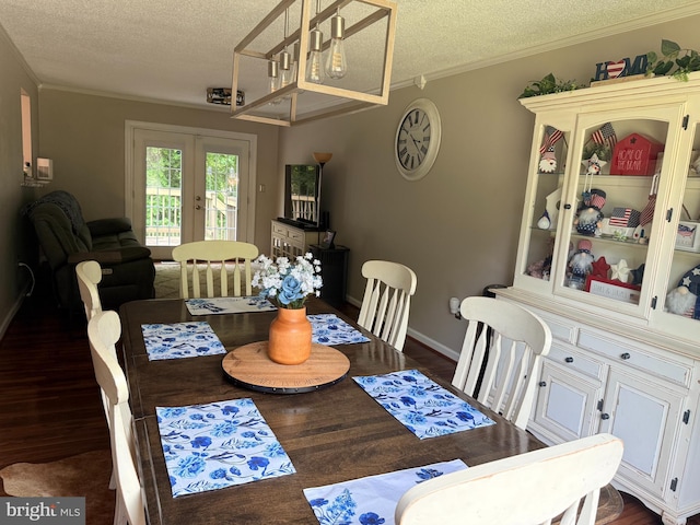 4123 Cassell Blvd, Prince Frederick, MD 20678 - dining area featuring a textured ceiling, dark wood finished floors, french doors, and crown molding