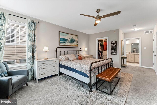519 S Media Way, Media, PA 19063 - bedroom featuring light carpet, a walk in closet, a closet, a ceiling fan, and ensuite bath