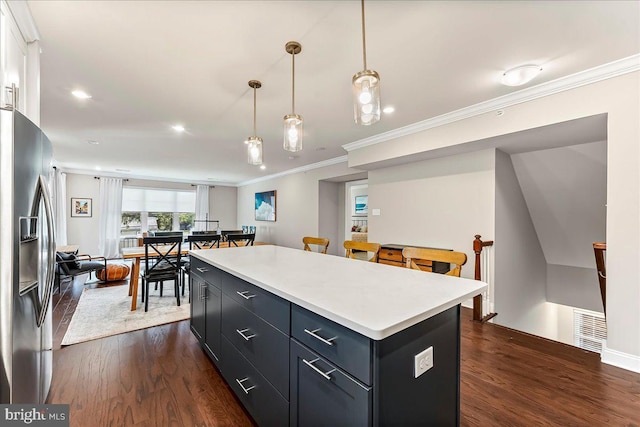 519 S Media Way, Media, PA 19063 - kitchen featuring stainless steel fridge, ornamental molding, a kitchen island, light countertops, and dark wood-type flooring