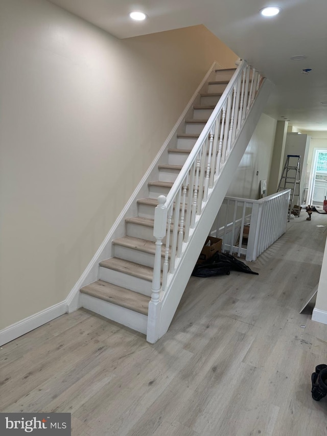 2215 N Pine St, Wilmington, DE 19802 - stairway featuring wood finished floors and recessed lighting