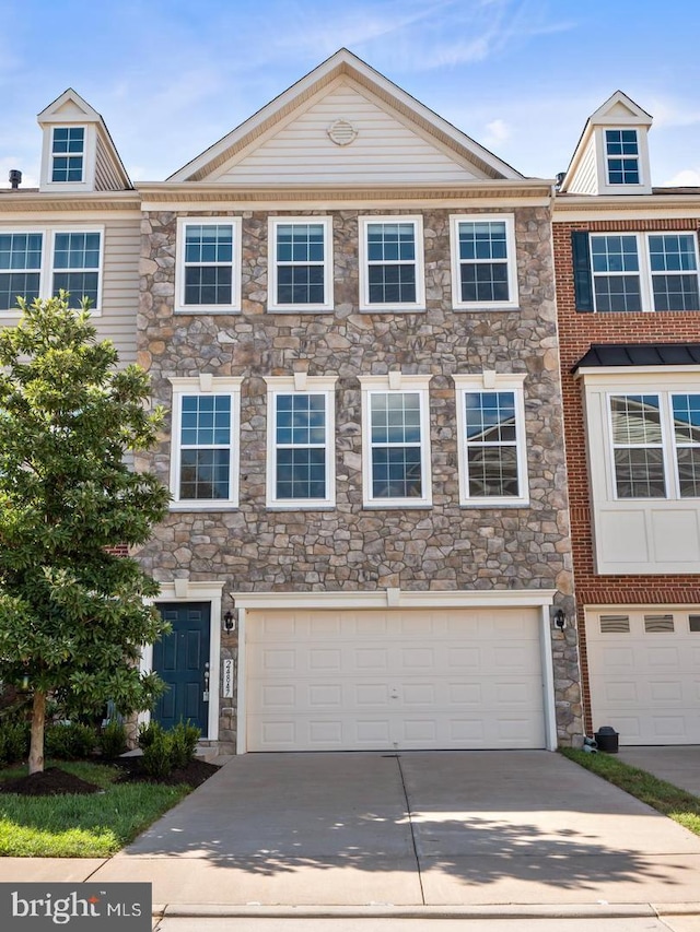 24847 Mason Dale Ter, Chantilly, VA 20152 - townhome / multi-family property featuring a garage, driveway, and stone siding