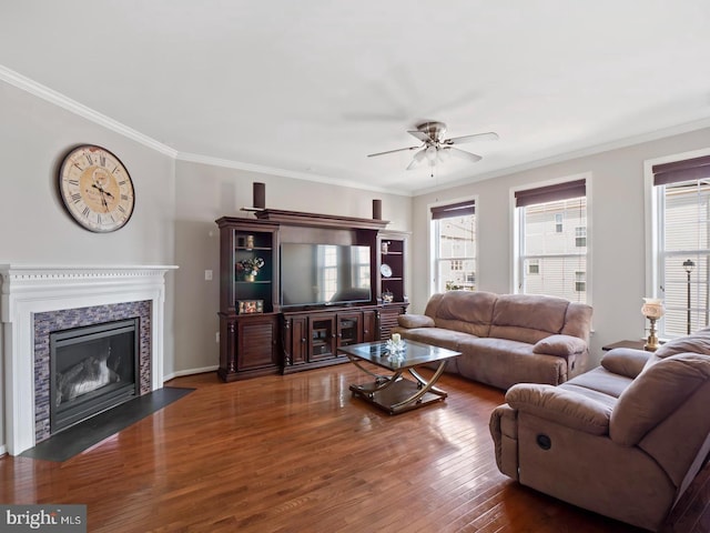 24847 Mason Dale Ter, Chantilly, VA 20152 - living room with healthy amount of natural light, ceiling fan, crown molding, wood finished floors, and a fireplace with flush hearth