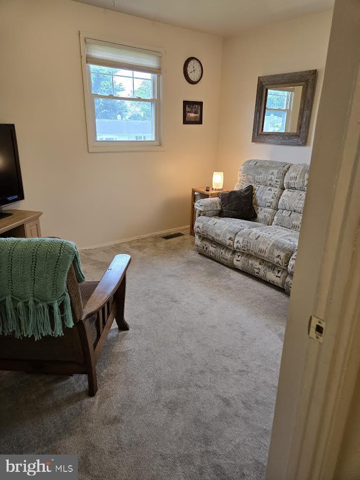 3277 Sudlersville S, Laurel, MD 20724 - carpeted living room featuring plenty of natural light