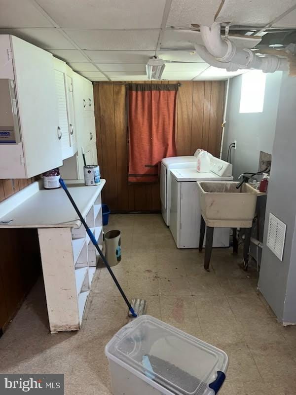 5904 Willet Ave, Baltimore, MD 21206 - basement with washer and clothes dryer, a drop ceiling, and light floors