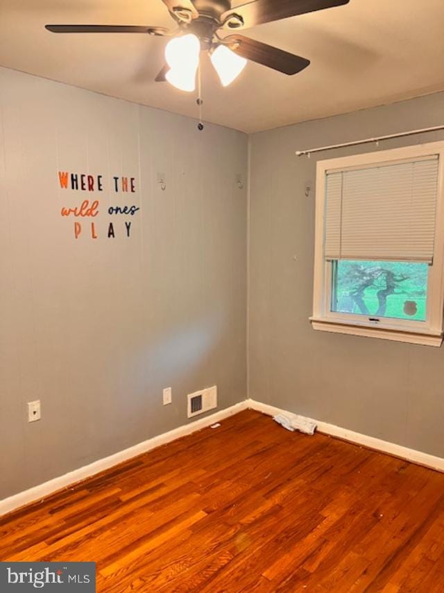 5904 Willet Ave, Baltimore, MD 21206 - empty room with wood finished floors and a ceiling fan