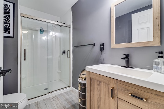 104 W Hawthorne Dr, La Plata, MD 20646 - full bathroom featuring vanity, a stall shower, and wood finished floors