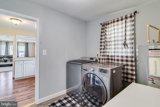 104 W Hawthorne Dr, La Plata, MD 20646 - laundry room featuring separate washer and dryer, electric water heater, and wood finished floors