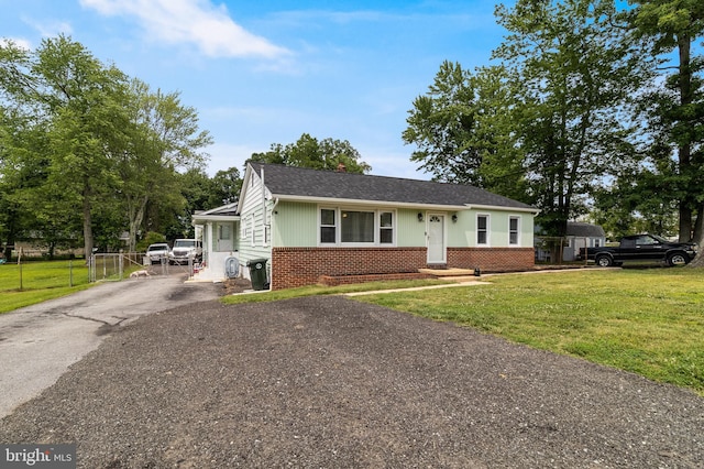 104 W Hawthorne Dr, La Plata, MD 20646 - view of front of home featuring brick siding, driveway, entry steps, and roof with shingles