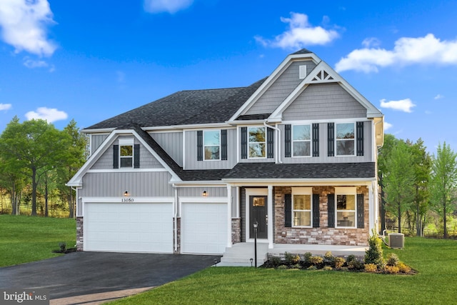 121 Lillian Ct, Fredericksburg, VA 22406 - craftsman inspired home with asphalt driveway, a front yard, an attached garage, and board and batten siding