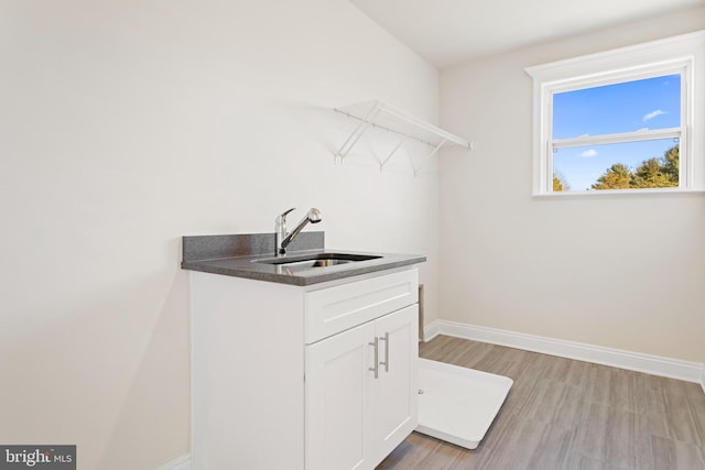 121 Lillian Ct, Fredericksburg, VA 22406 - laundry room featuring a sink and light wood-style floors