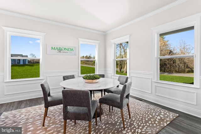 121 Lillian Ct, Fredericksburg, VA 22406 - dining space with dark wood finished floors, plenty of natural light, ornamental molding, and wainscoting