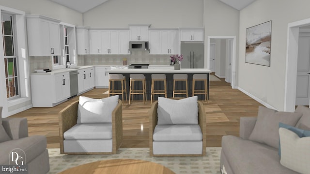 0 William And Mary Ln, Stafford, VA 22554 - living area featuring light wood-style flooring and high vaulted ceiling