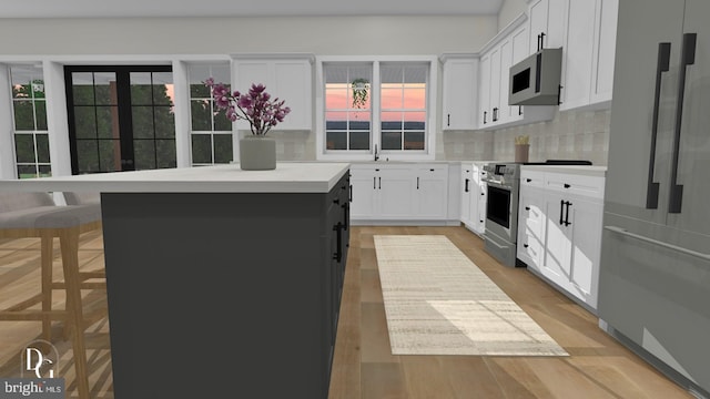 0 William And Mary Ln, Stafford, VA 22554 - kitchen featuring stainless steel appliances, a center island, backsplash, and light countertops