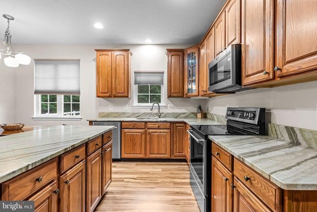 5 Fisher Ct, Sewell, NJ 08080 - kitchen featuring appliances with stainless steel finishes, brown cabinets, light wood-style floors, plenty of natural light, and recessed lighting