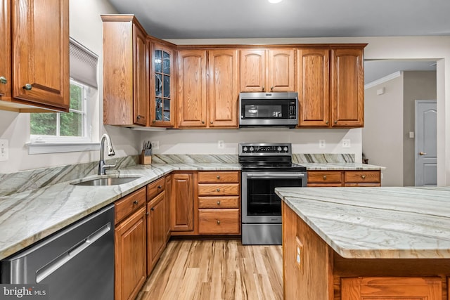 5 Fisher Ct, Sewell, NJ 08080 - kitchen with stainless steel appliances, light wood-type flooring, brown cabinets, glass insert cabinets, and light stone countertops