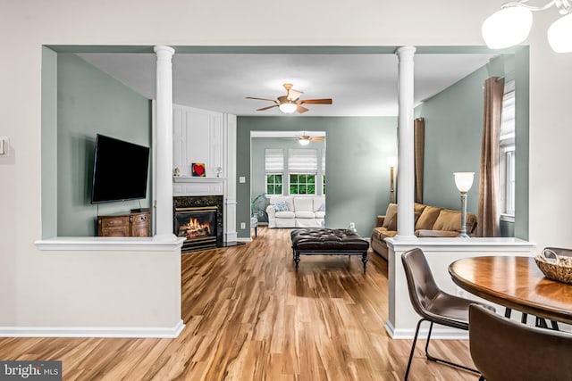 5 Fisher Ct, Sewell, NJ 08080 - living room with ornate columns, light wood-style floors, ceiling fan, and a high end fireplace