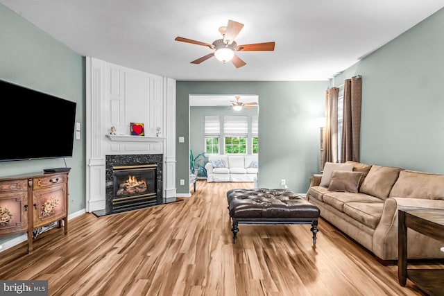 5 Fisher Ct, Sewell, NJ 08080 - living room with a ceiling fan, light wood-type flooring, and a fireplace