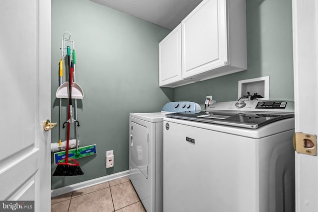 5 Fisher Ct, Sewell, NJ 08080 - laundry room featuring washer and dryer, cabinet space, and light tile patterned floors