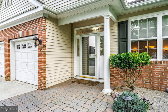 5 Fisher Ct, Sewell, NJ 08080 - property entrance with brick siding, a garage, and concrete driveway