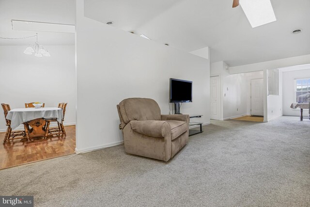 28 Abbey Ct, Carlisle, PA 17015 - living room with carpet, a chandelier, high vaulted ceiling, and a skylight