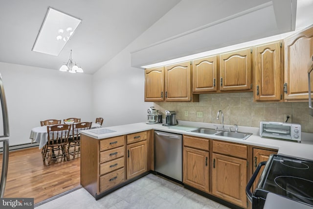 28 Abbey Ct, Carlisle, PA 17015 - kitchen with stainless steel dishwasher, black range with electric cooktop, vaulted ceiling, a peninsula, and a chandelier