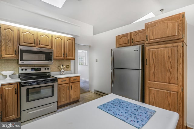 28 Abbey Ct, Carlisle, PA 17015 - kitchen featuring stainless steel appliances, light countertops, a baseboard radiator, and tasteful backsplash