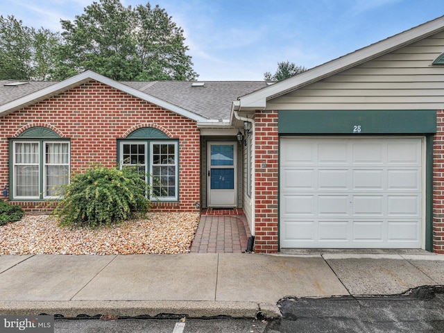 28 Abbey Ct, Carlisle, PA 17015 - ranch-style home with brick siding, roof with shingles, an attached garage, and concrete driveway