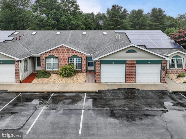 28 Abbey Ct, Carlisle, PA 17015 - view of property with brick siding, solar panels, and a shingled roof