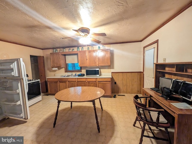 475 Company Farm Rd, Aspers, PA 17304 - kitchen with light floors, gas range gas stove, stainless steel microwave, a wainscoted wall, and crown molding