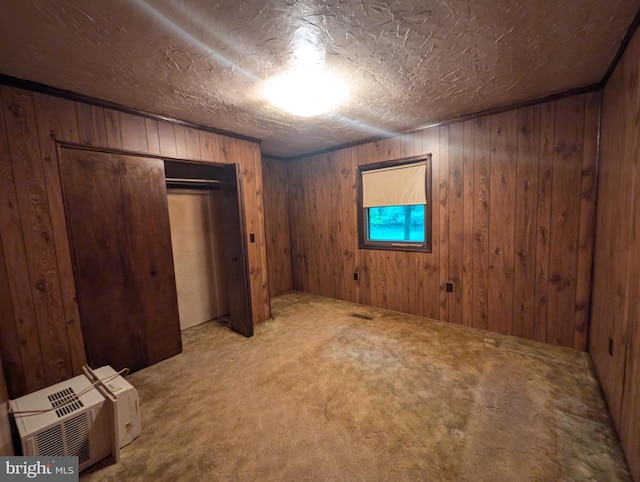 475 Company Farm Rd, Aspers, PA 17304 - unfurnished bedroom featuring carpet flooring, wooden walls, and a closet
