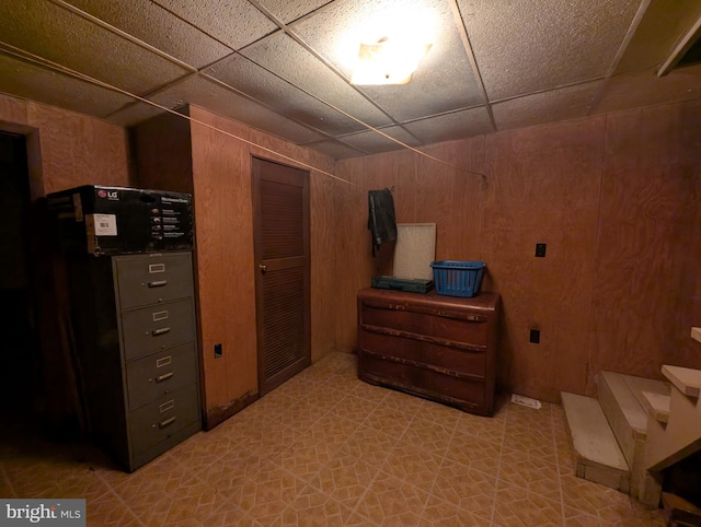 475 Company Farm Rd, Aspers, PA 17304 - bedroom featuring wood walls, light floors, a closet, and a drop ceiling