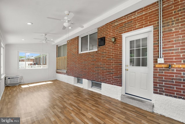 1028 Marleigh Cir, Baltimore, MD 21204 - unfurnished sunroom with a wall unit AC, ceiling fan, and vaulted ceiling