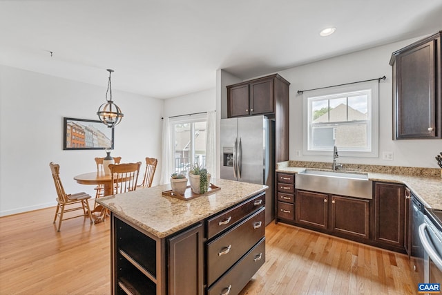 1254 Haden Pl, Crozet, VA 22932 - kitchen with stainless steel refrigerator with ice dispenser, light wood finished floors, dark brown cabinetry, plenty of natural light, and recessed lighting