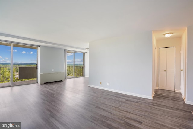 301 N Beauregard St Unit 1507, Alexandria, VA 22312 - empty room featuring dark wood-style floors and a wall of windows