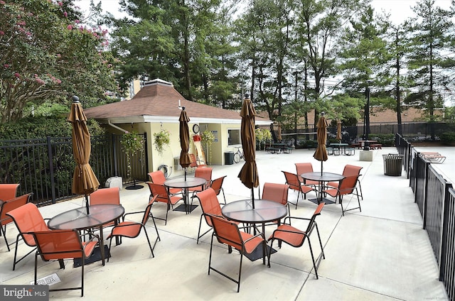 301 N Beauregard St Unit 1507, Alexandria, VA 22312 - view of patio featuring outdoor dining space and an outdoor structure