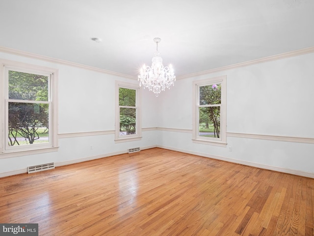 407 Owls Nest Rd, Wilmington, DE 19807 - unfurnished room with a chandelier, ornamental molding, and wood finished floors