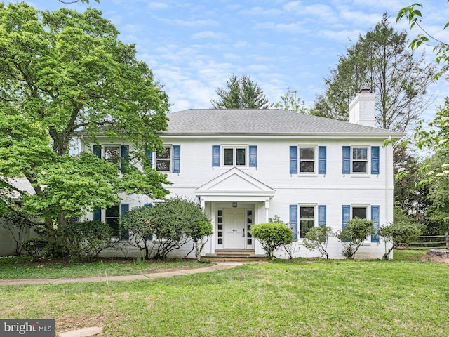 407 Owls Nest Rd, Wilmington, DE 19807 - colonial-style house featuring a chimney and a front yard