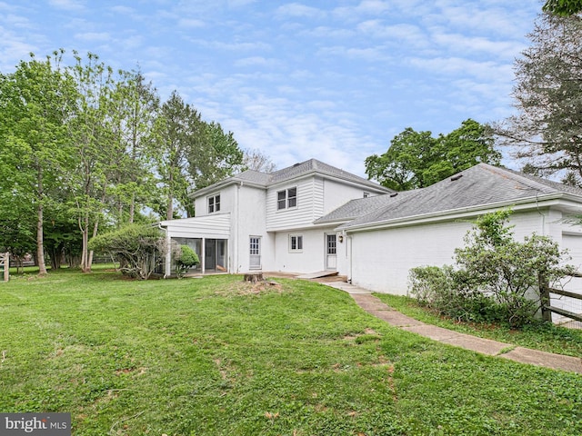 407 Owls Nest Rd, Wilmington, DE 19807 - view of front of home featuring a front yard, roof with shingles, a sunroom, and an attached garage