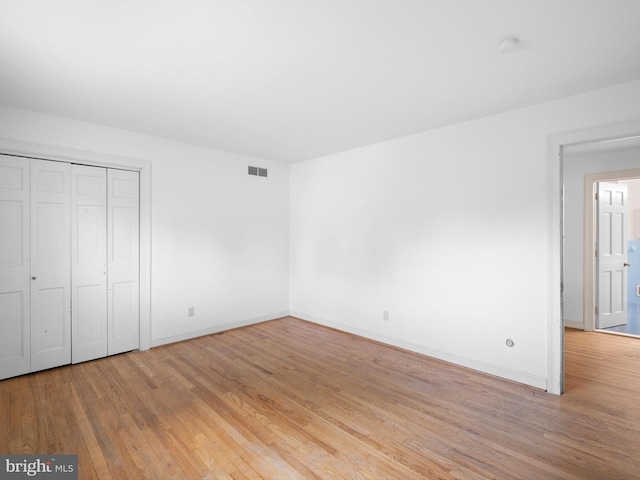 407 Owls Nest Rd, Wilmington, DE 19807 - unfurnished bedroom with light wood-style floors and a closet