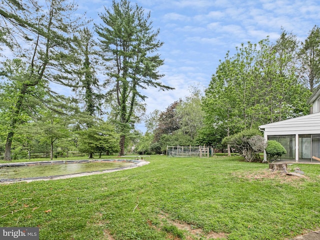 407 Owls Nest Rd, Wilmington, DE 19807 - view of green lawn featuring a sunroom and view of wooded area