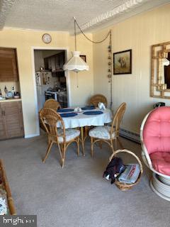 718 Mooring Rd Unit B203, Ocean City, MD 21842 - dining space with a textured ceiling and carpet floors