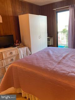 718 Mooring Rd Unit B203, Ocean City, MD 21842 - bedroom with wood walls