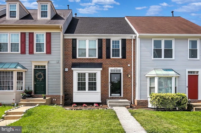 21196 Winding Brook Sq, Ashburn, VA 20147 - multi unit property featuring brick siding, a front lawn, entry steps, and roof with shingles