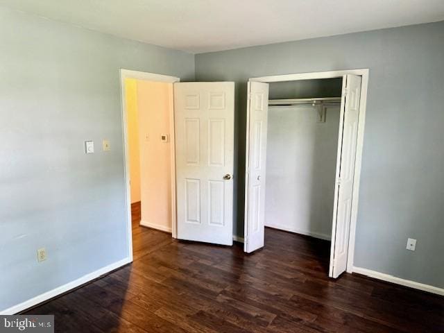 56 W Bishop Ln, Smithsburg, MD 21783 - unfurnished bedroom with dark wood-style flooring and a closet