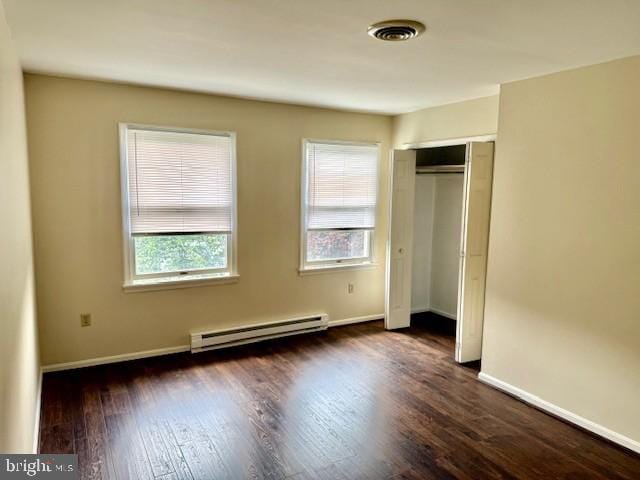 56 W Bishop Ln, Smithsburg, MD 21783 - unfurnished bedroom with a baseboard radiator, dark wood-style floors, and a closet