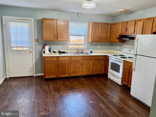 56 W Bishop Ln, Smithsburg, MD 21783 - kitchen featuring white appliances, under cabinet range hood, light countertops, dark wood finished floors, and brown cabinetry