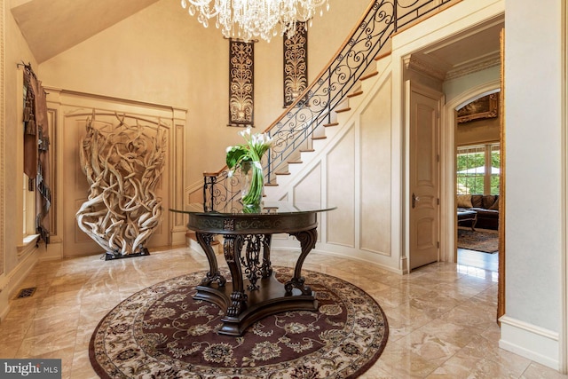3500 Windy Bush Rd, New Hope, PA 18938 - foyer with light marble finish flooring, a high ceiling, a chandelier, a decorative wall, and stairway