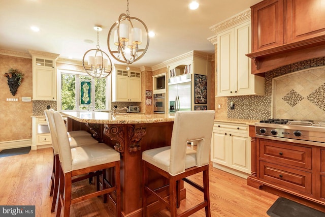 3500 Windy Bush Rd, New Hope, PA 18938 - kitchen featuring appliances with stainless steel finishes, a chandelier, glass insert cabinets, light stone countertops, and ornamental molding