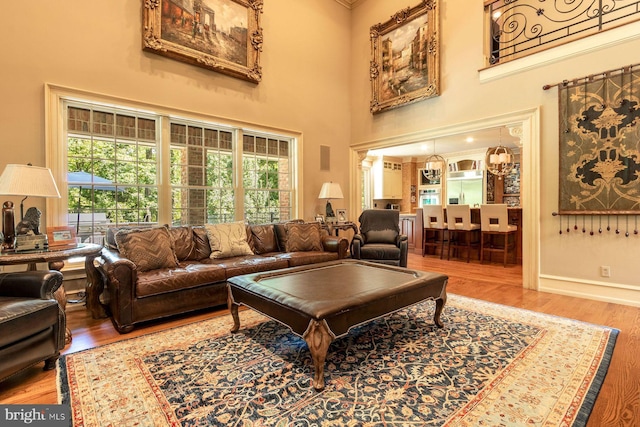 3500 Windy Bush Rd, New Hope, PA 18938 - living area featuring wood finished floors, a high ceiling, and healthy amount of natural light